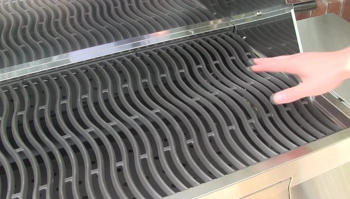 Napoleon wave grill grates: reversible, porcelain-coated cast iron.