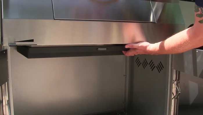Grill's removable ash tray and drip pan