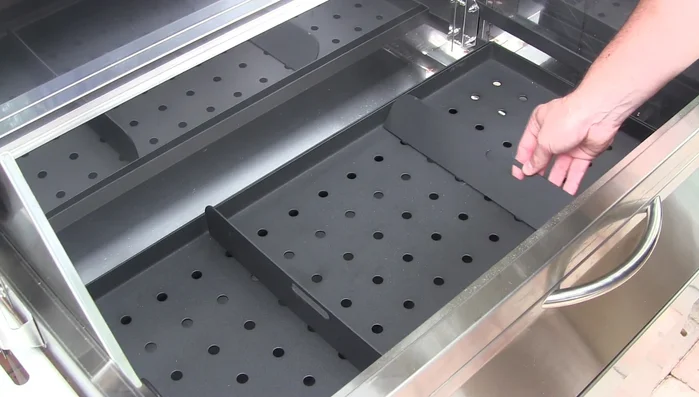 Adjustable charcoal tray with heat dividers
