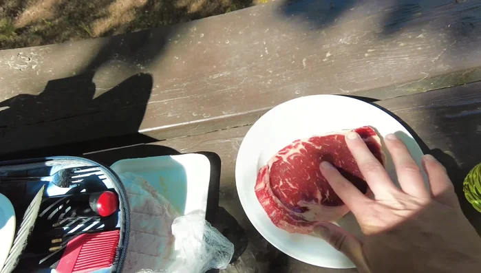 Raw steak ready for grilling outdoors