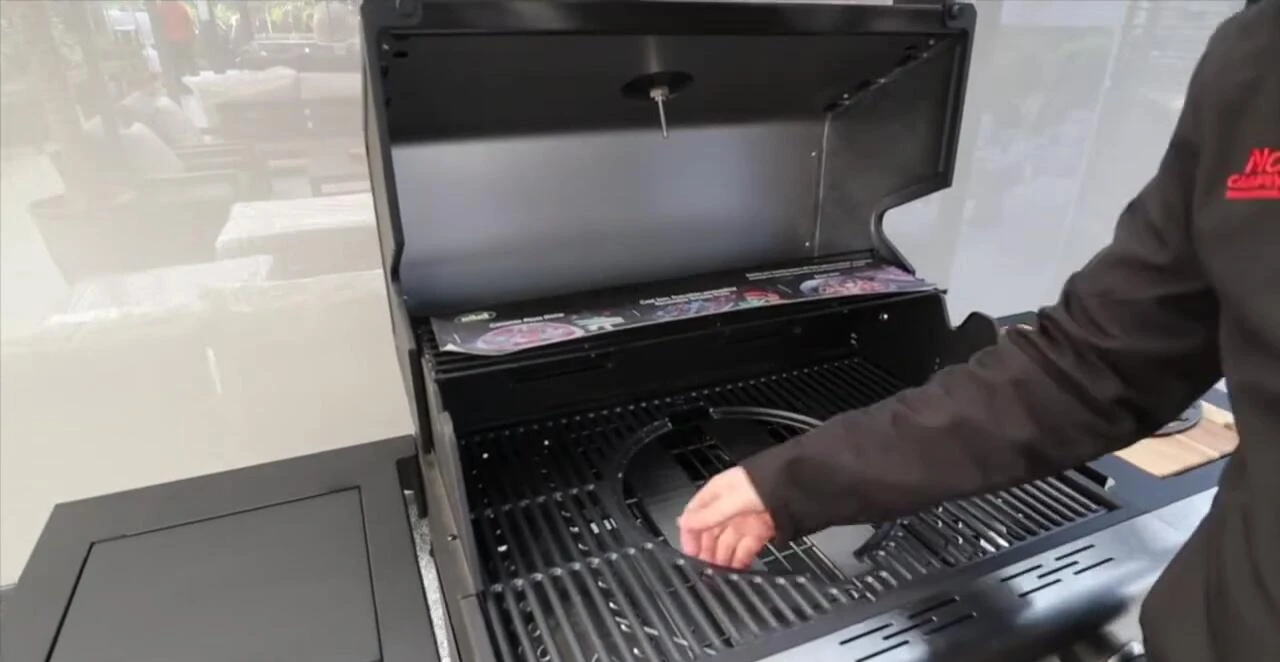 Modular gas grill with interchangeable cooking surfaces