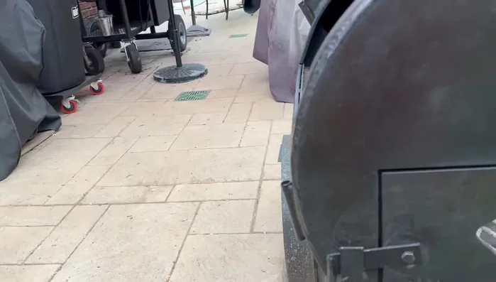 Custom smoker with reversed handle