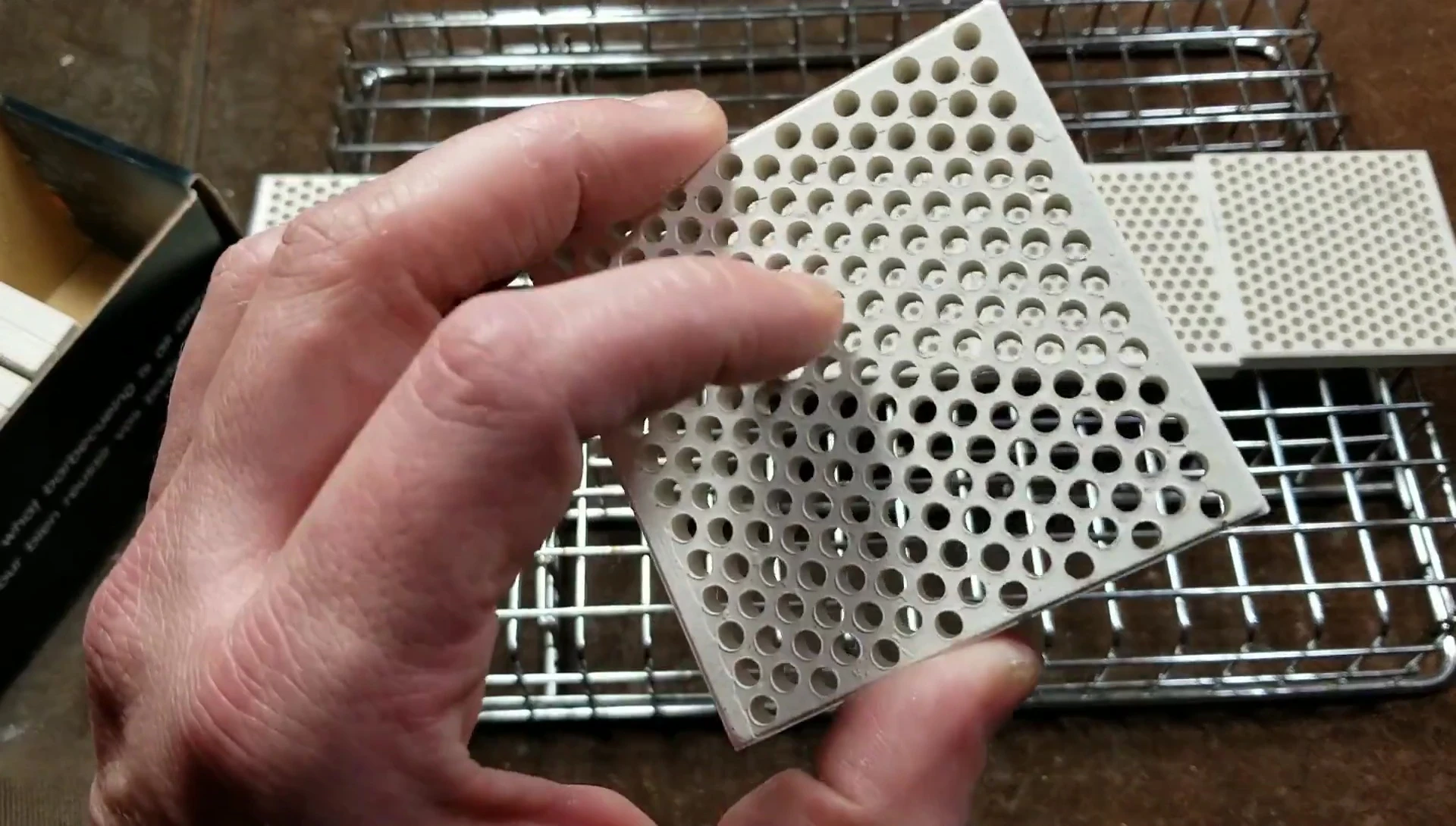 Fragile ceramic bricks in protective rack
