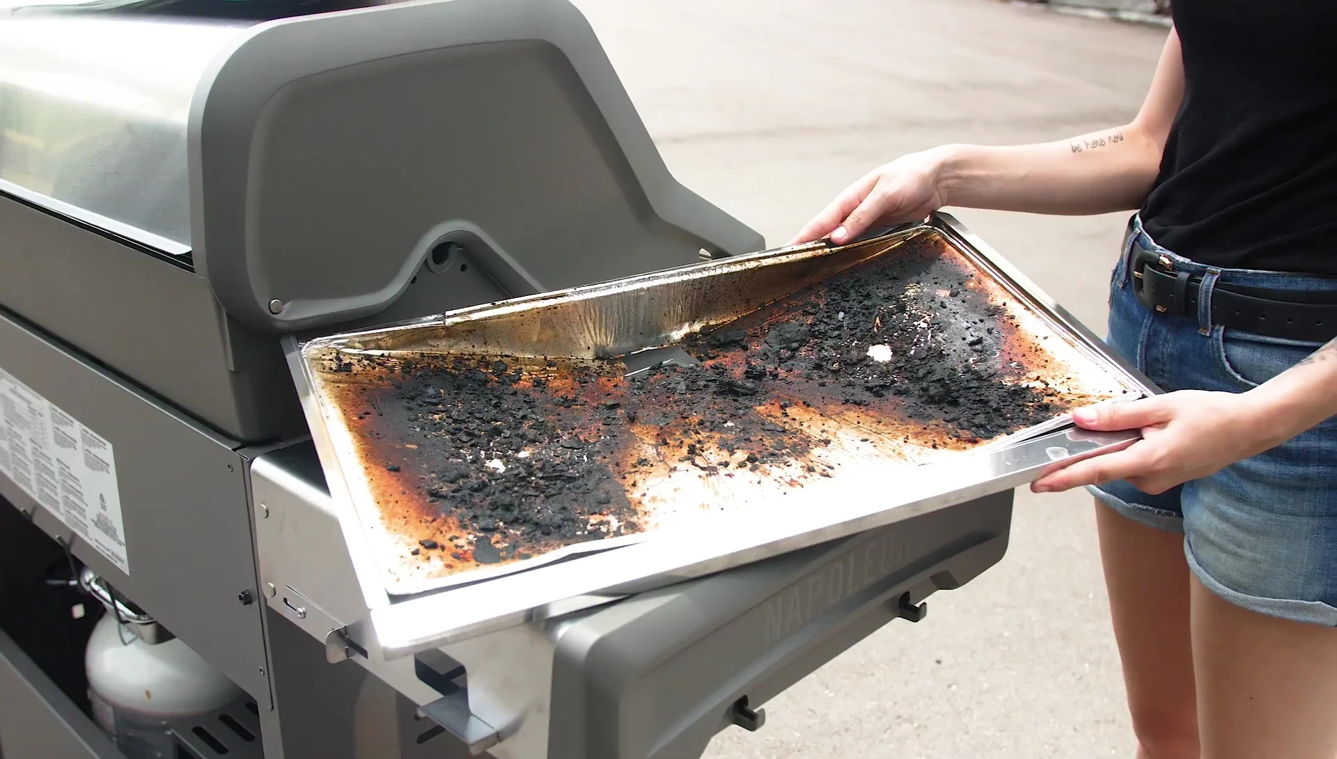 Close-up view of a used drip pan liner.