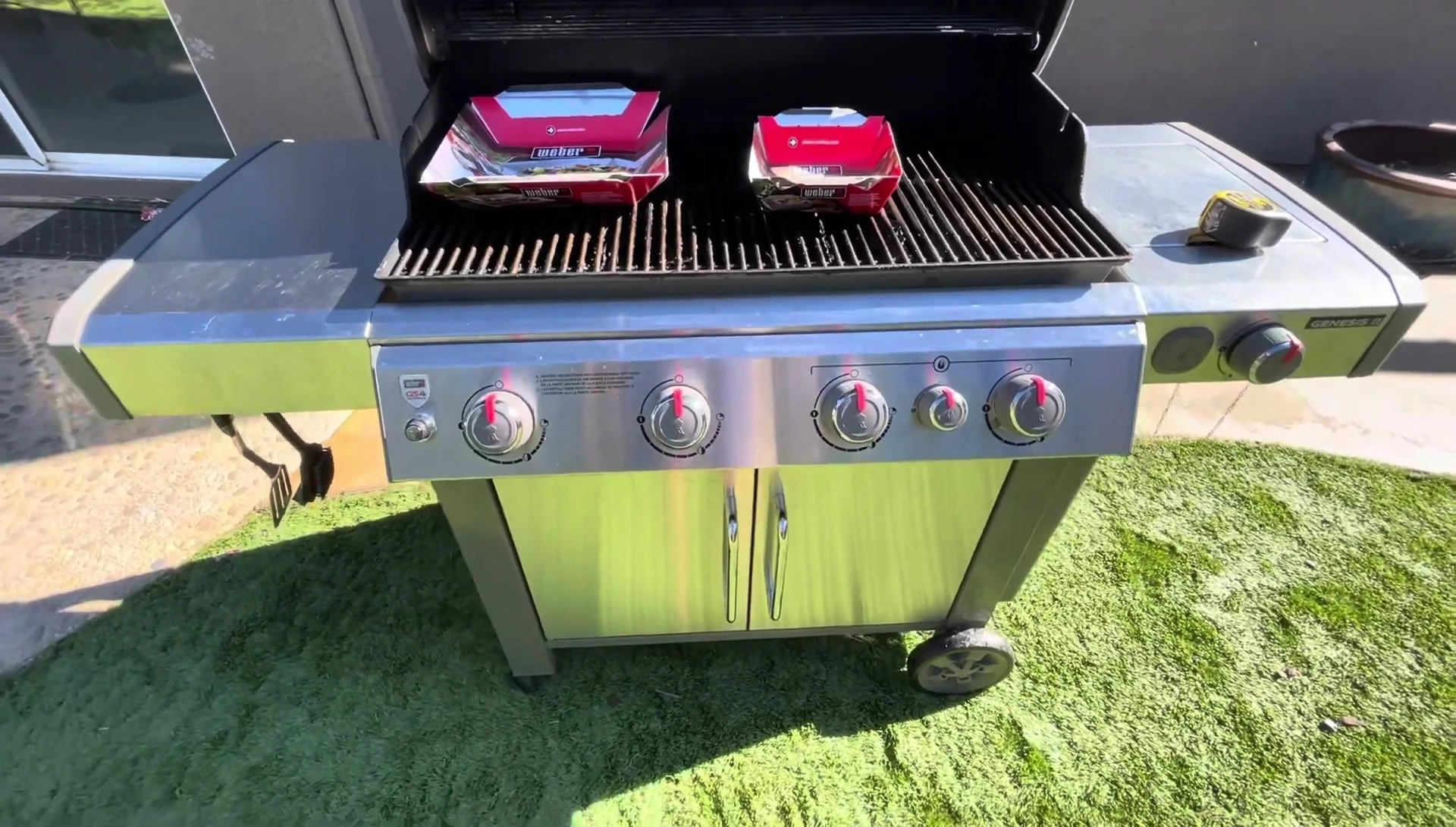 Weber grill with two different sized baskets.