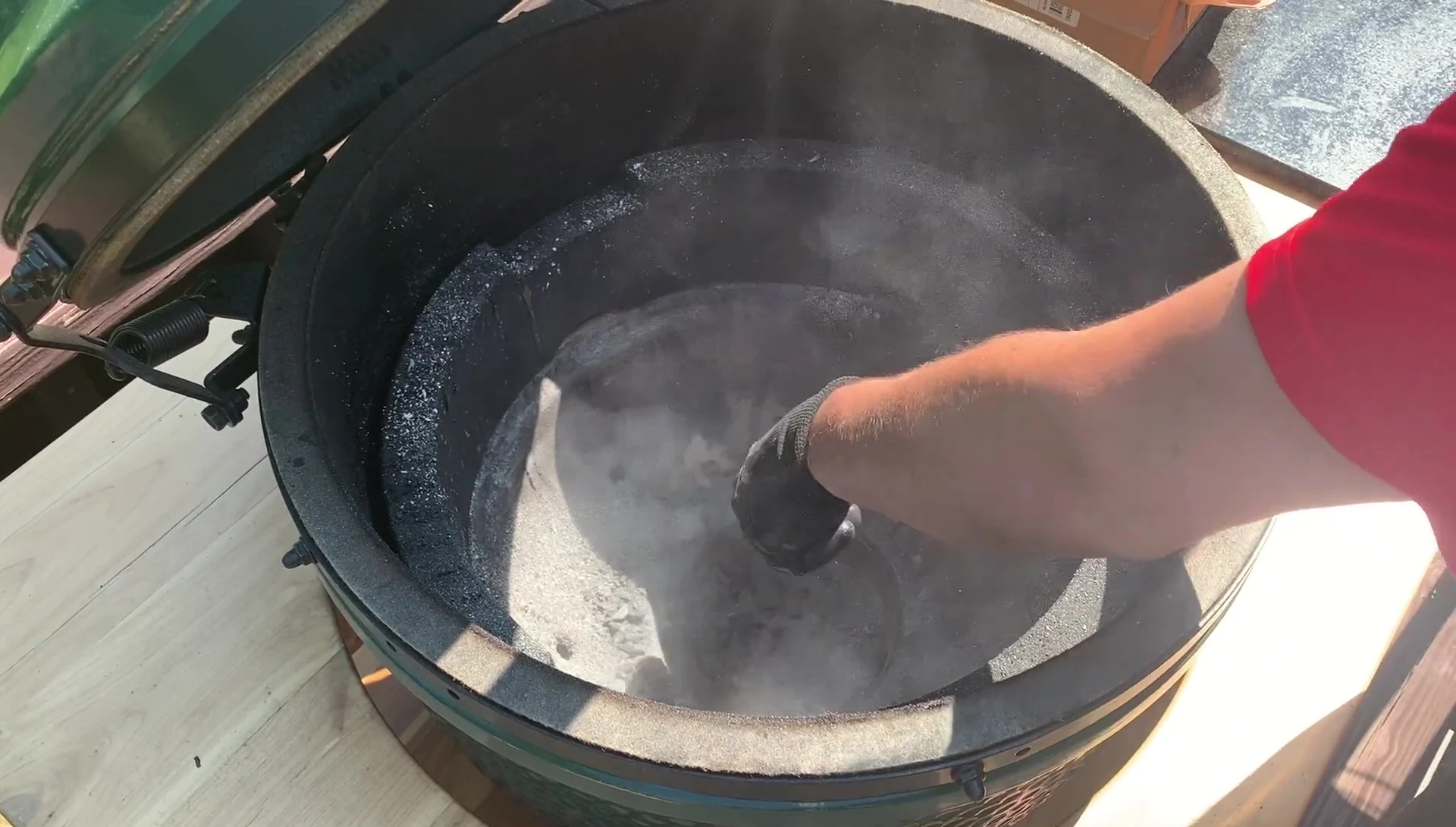 Ash removal from Green Egg smoker.