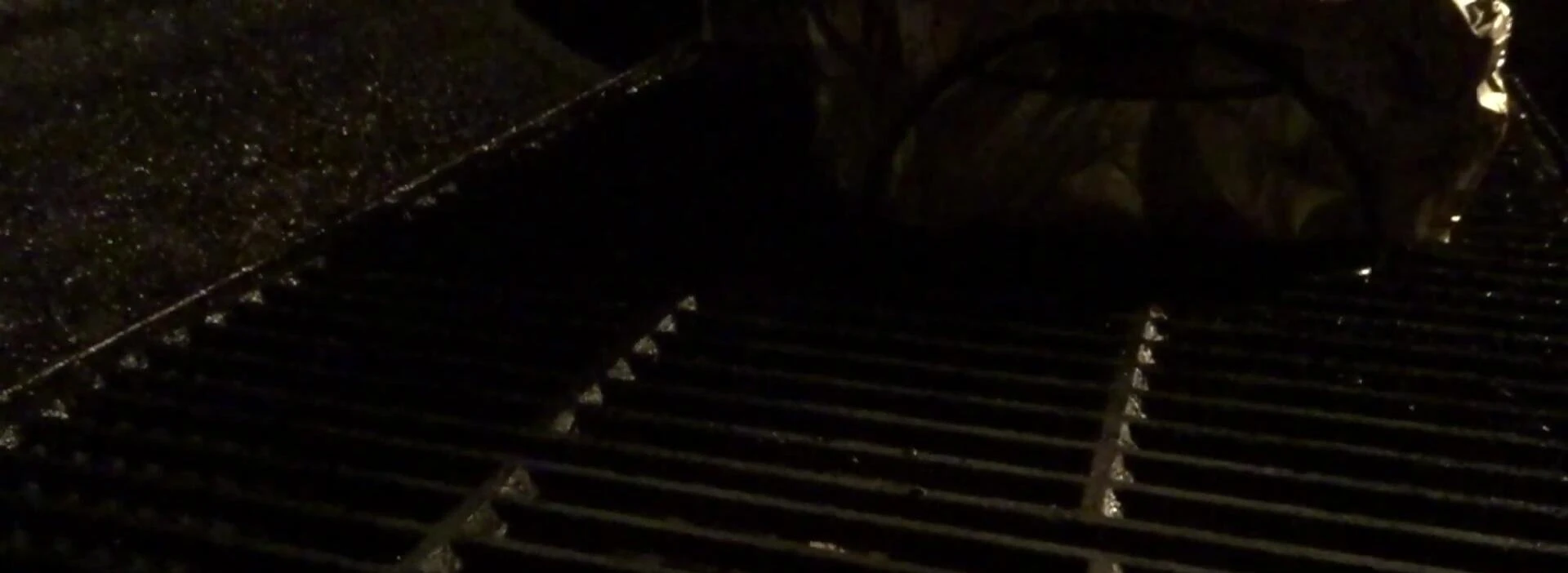 Grilling ribs over hot coals