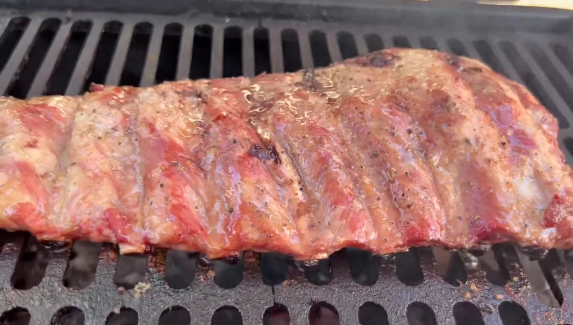 Grilled ribs, char, smoky flavor