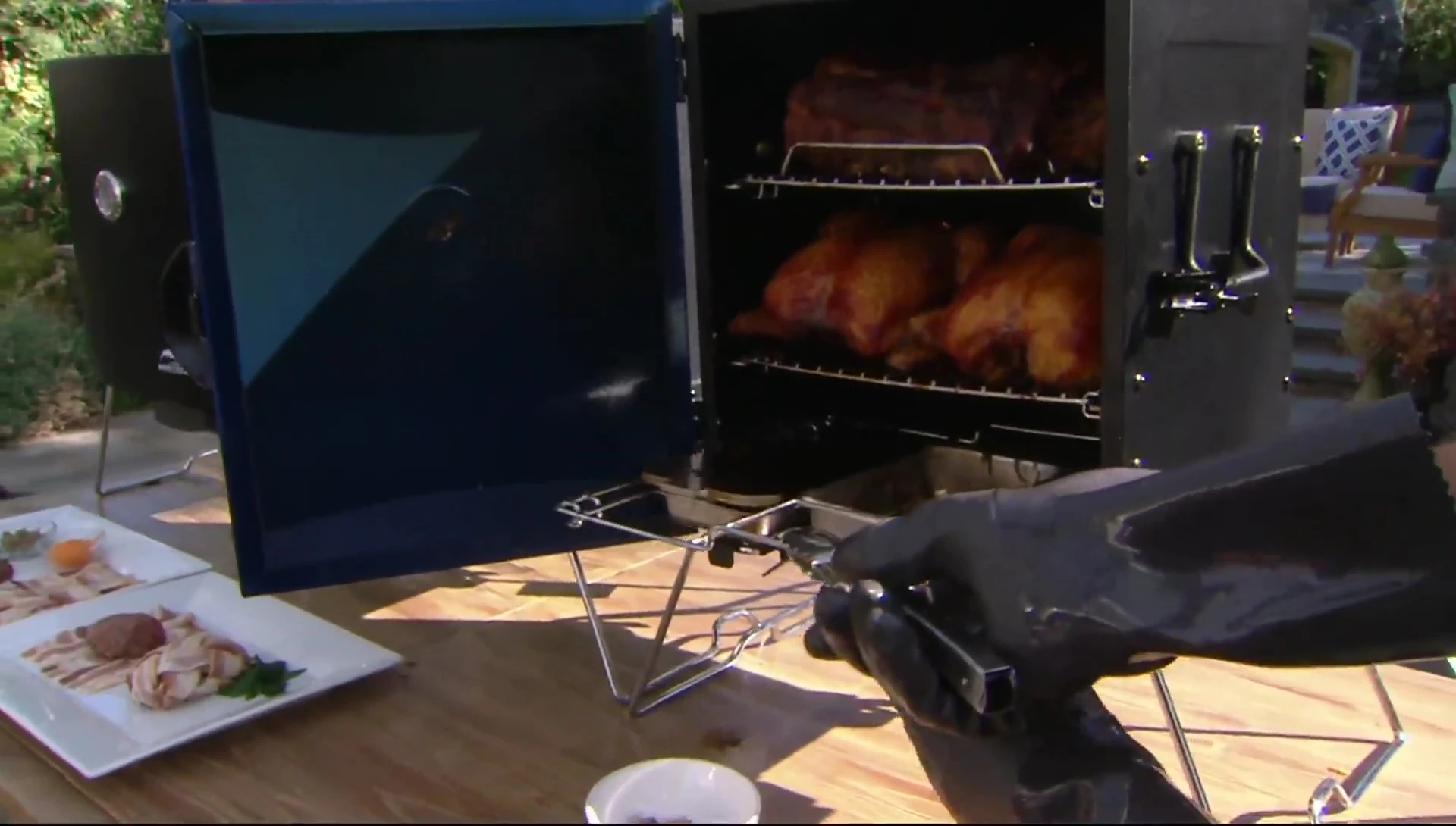 Masterbuilt smoker cooking ribs and chicken