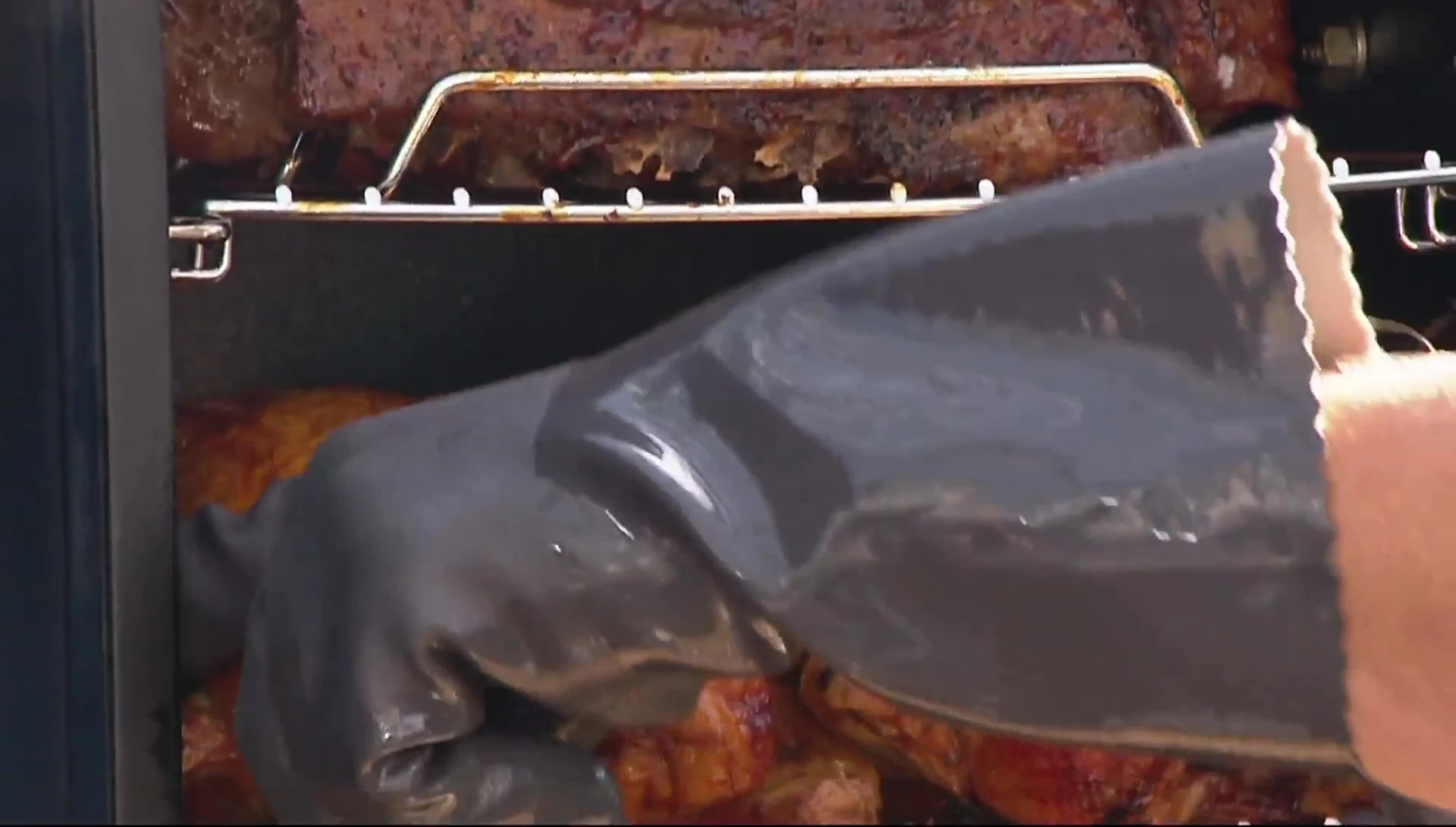 Smoker with racks, cooking meat