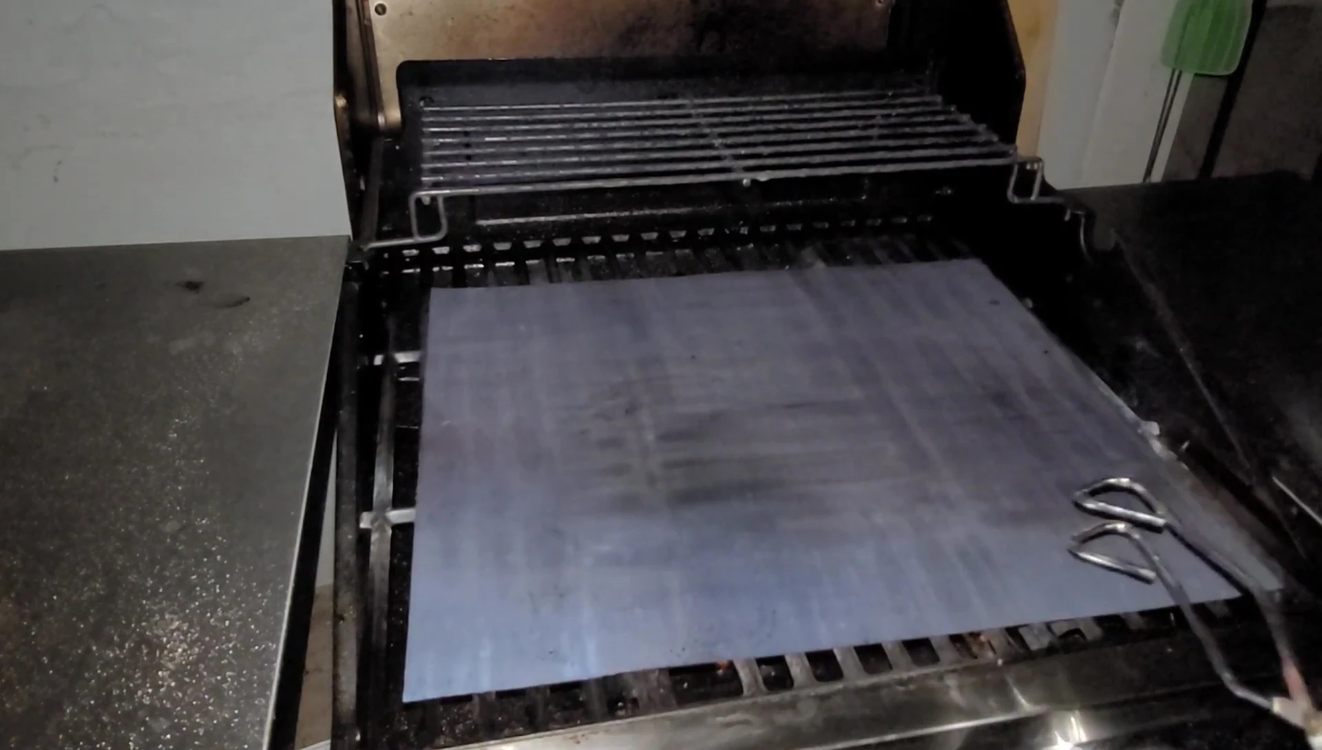 Grilled sausages on grill mat