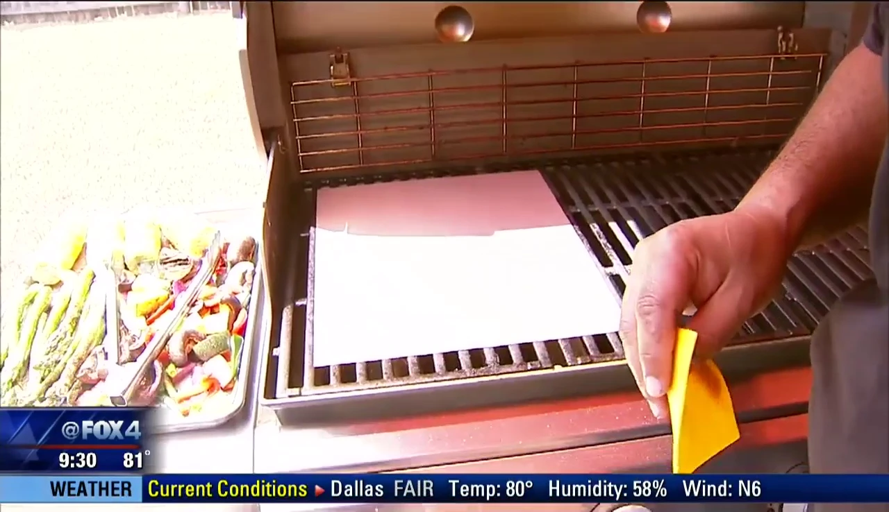 Grilling cheese on non-stick mat.