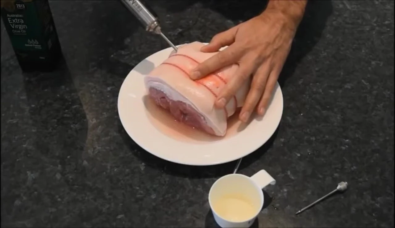 Meat being injected with marinade