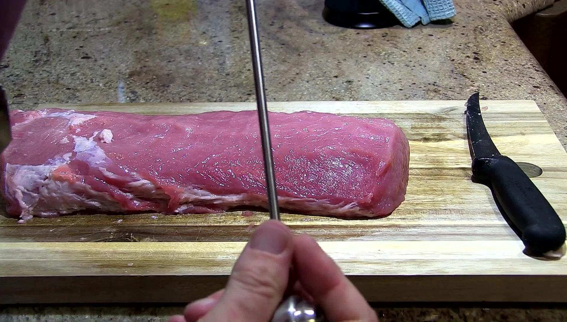 The longer nozzle being examined.