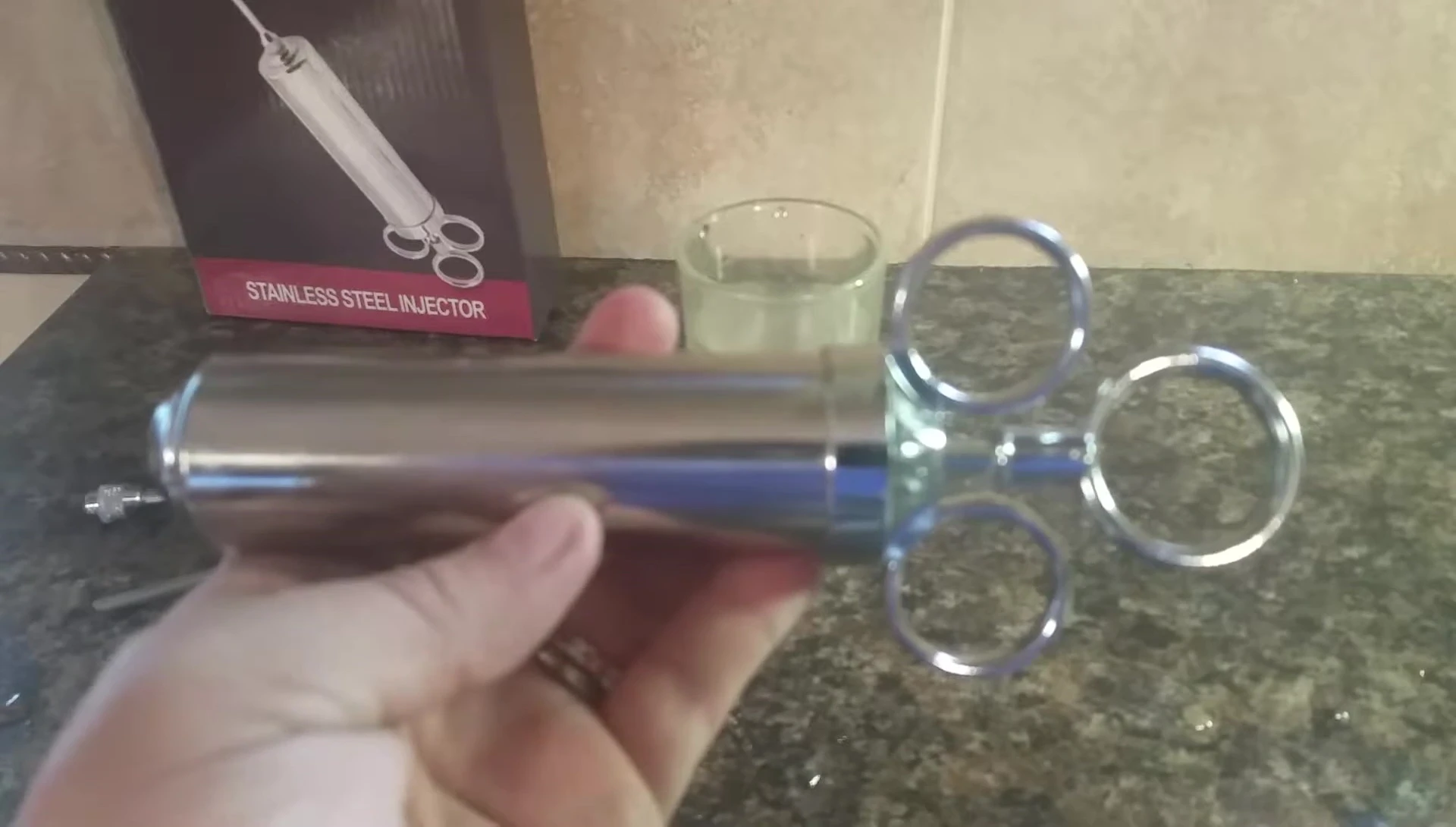 Stainless steel injector with a stuck plunger.