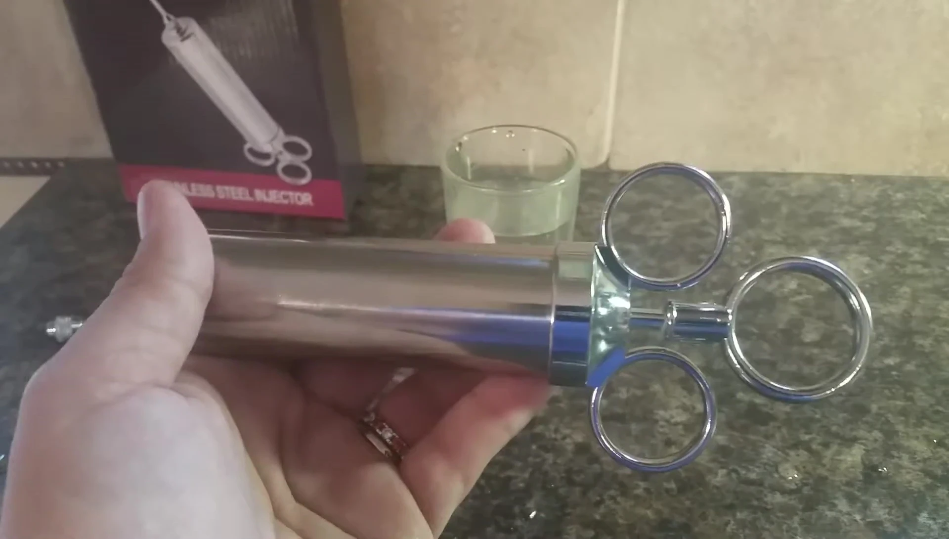 Stainless steel injector with stuck plunger.