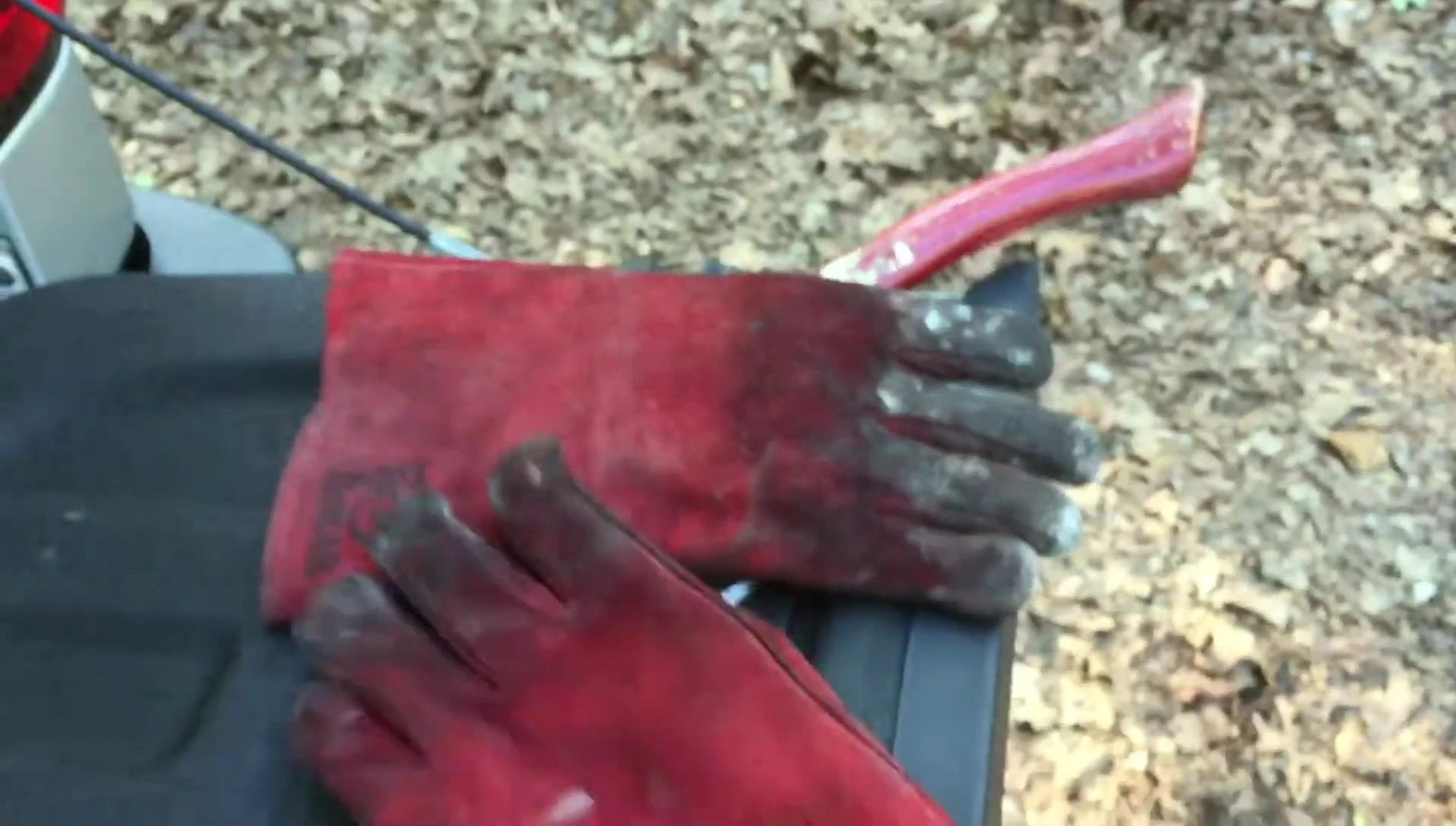 Worn heat-resistant gloves, heavy use.