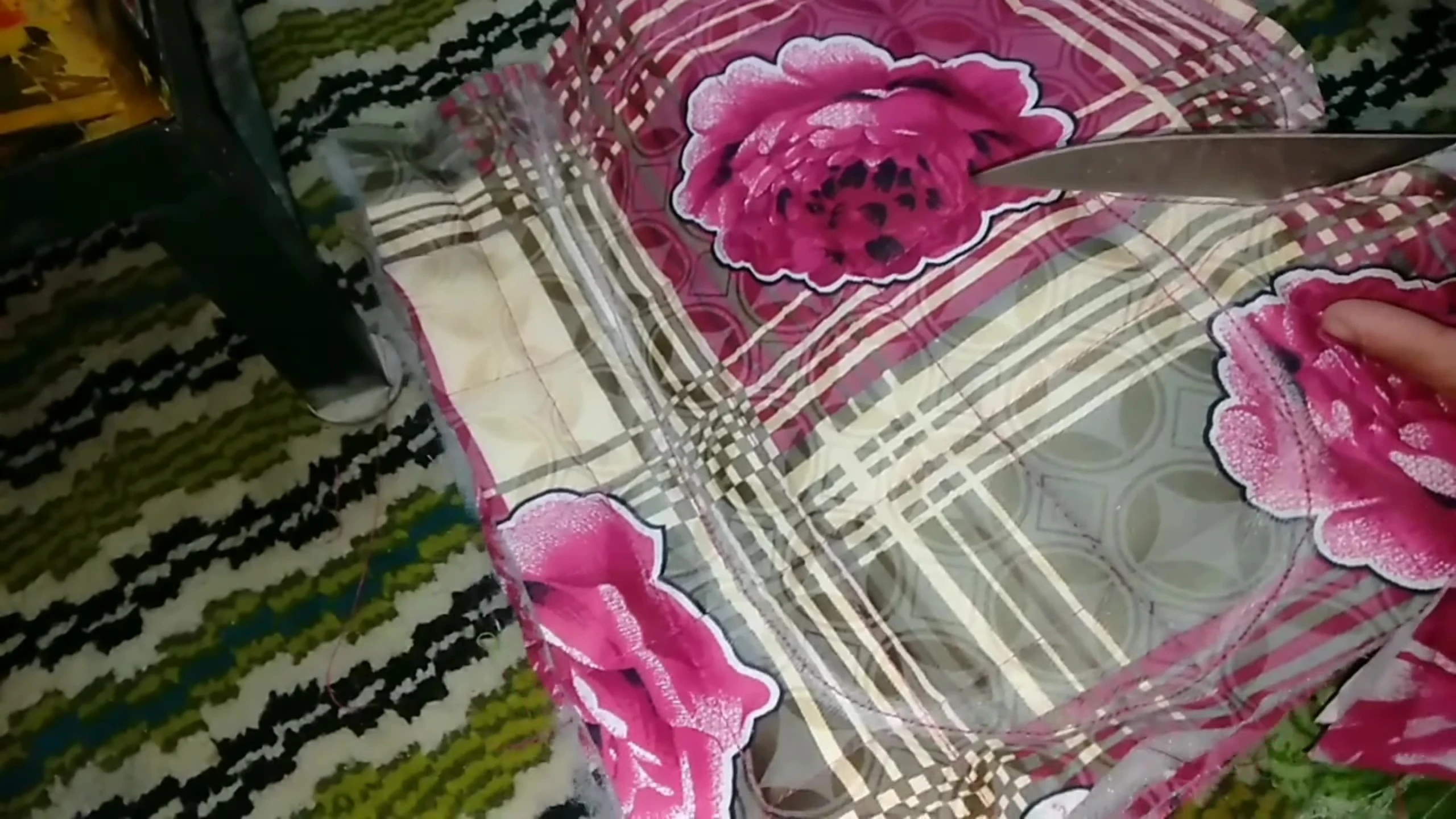 Cutting excess fabric.