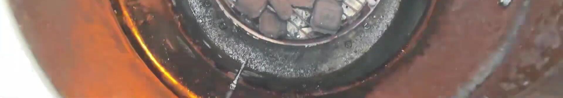 Charcoal igniting in Pit Barrel Cooker