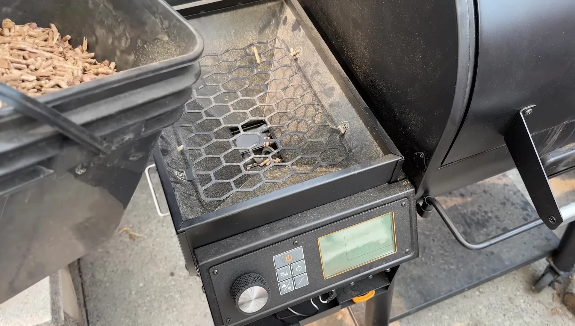 Pellet grill hopper loaded with wood pellets