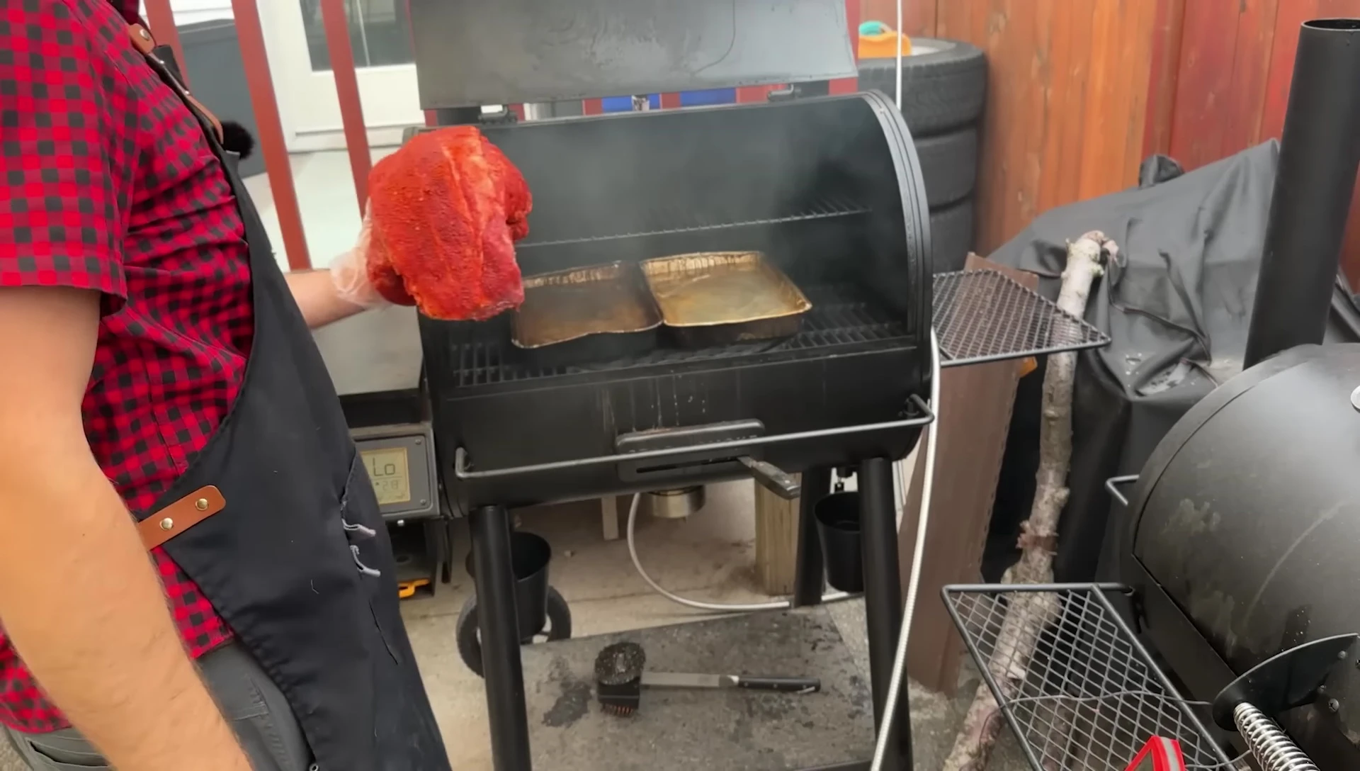 Smoked meat cooking in a smoker