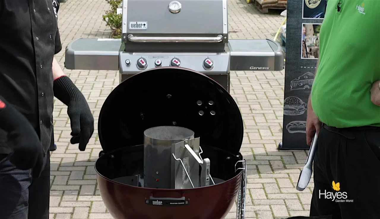 Removing coals from chimney starter.