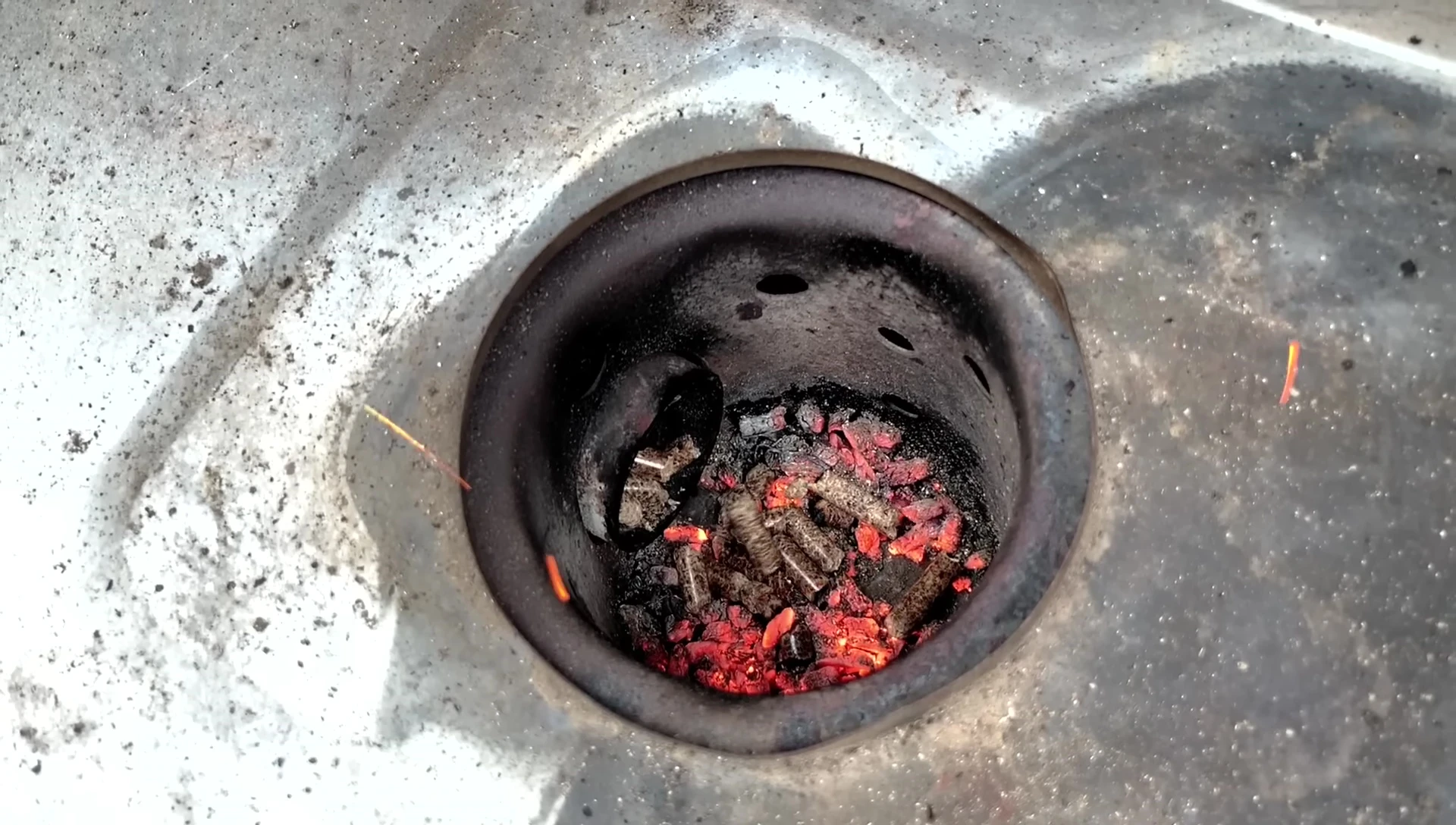Charcoal smoker burning wood pellets