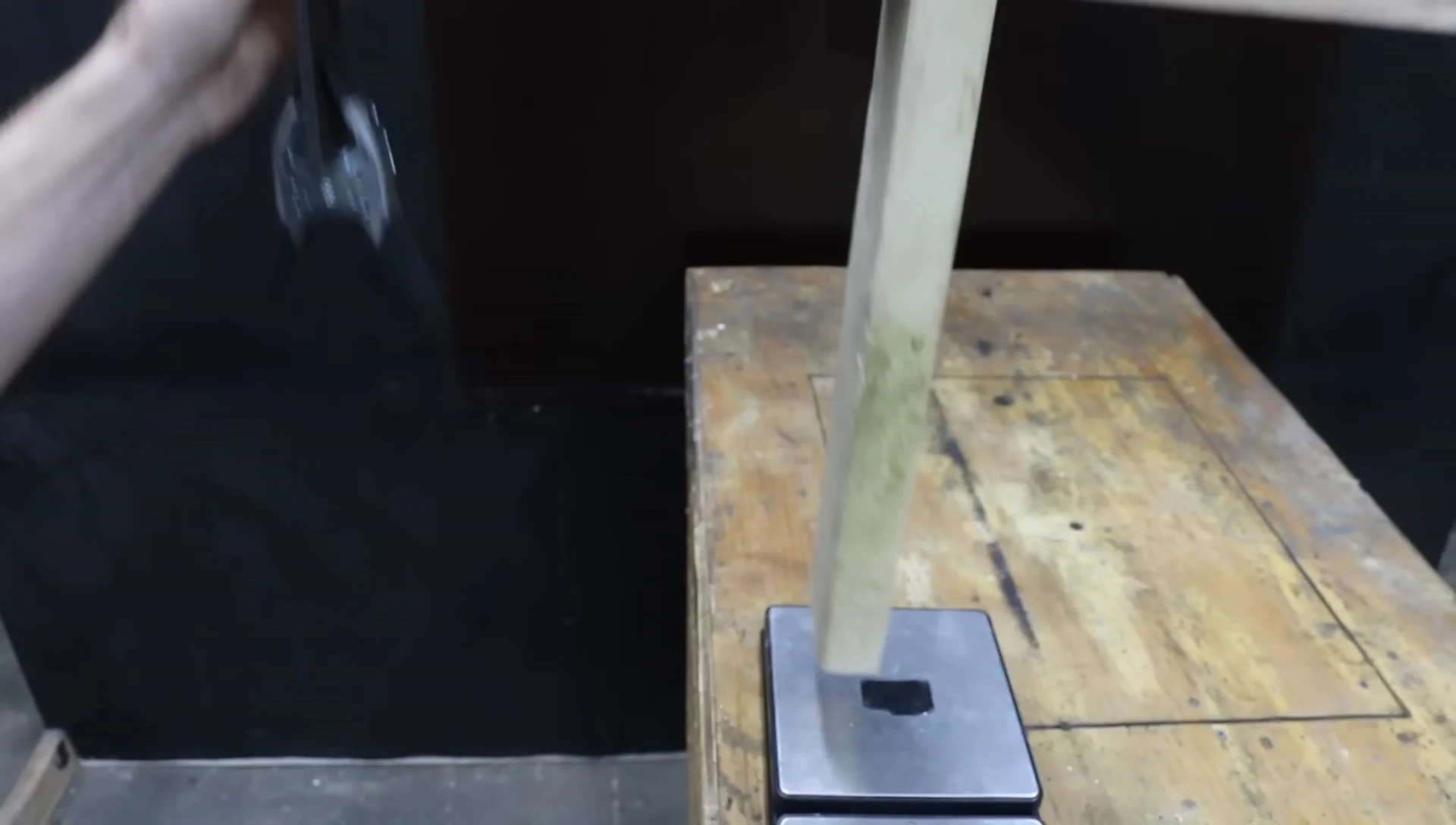Glove grip test using weighted clamp.