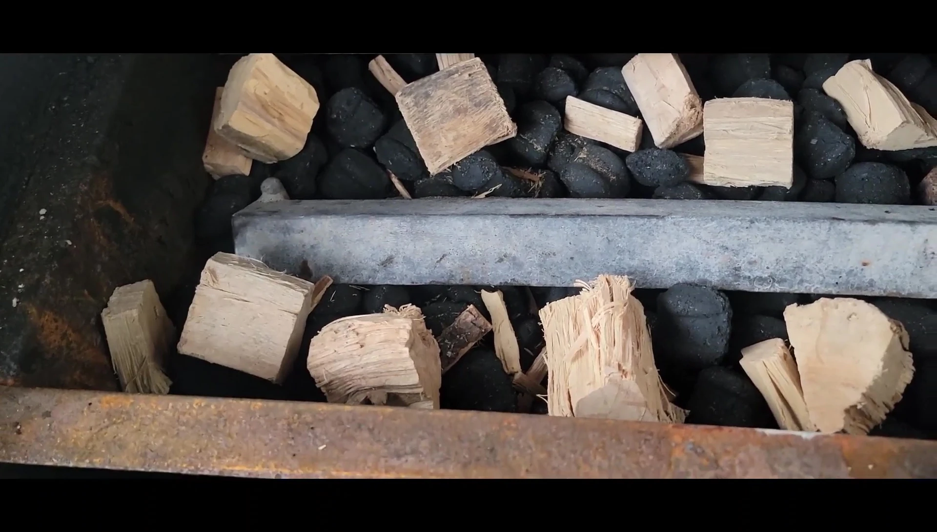 Smoker with charcoal and wood chunks