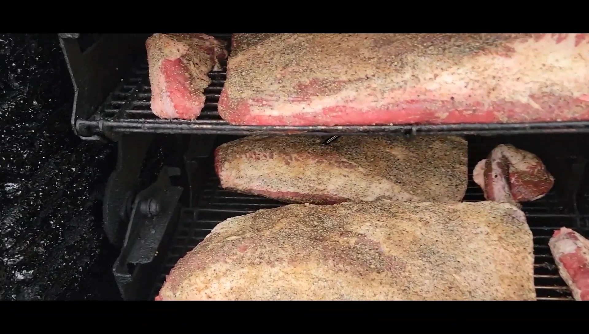 Seasoned briskets ready for smoking