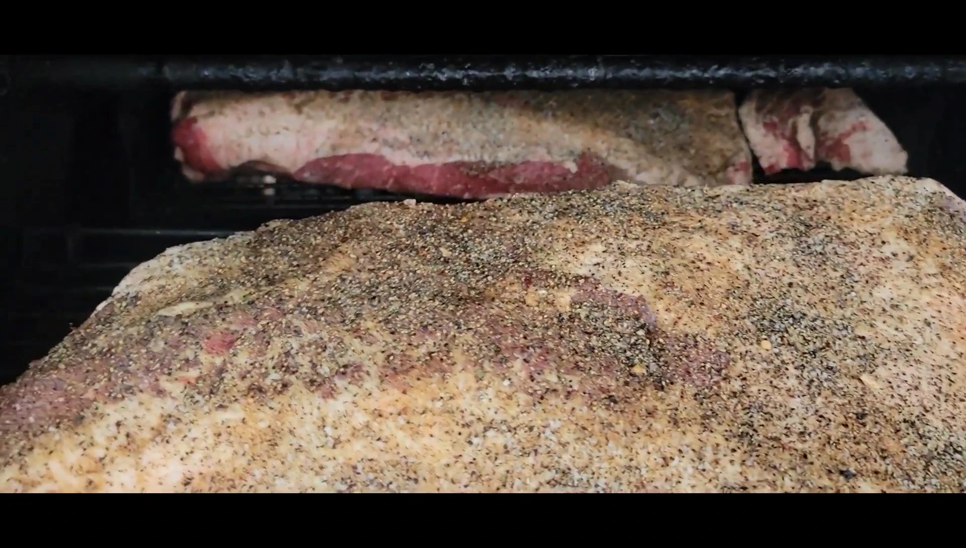 Seasoned brisket ready for smoking