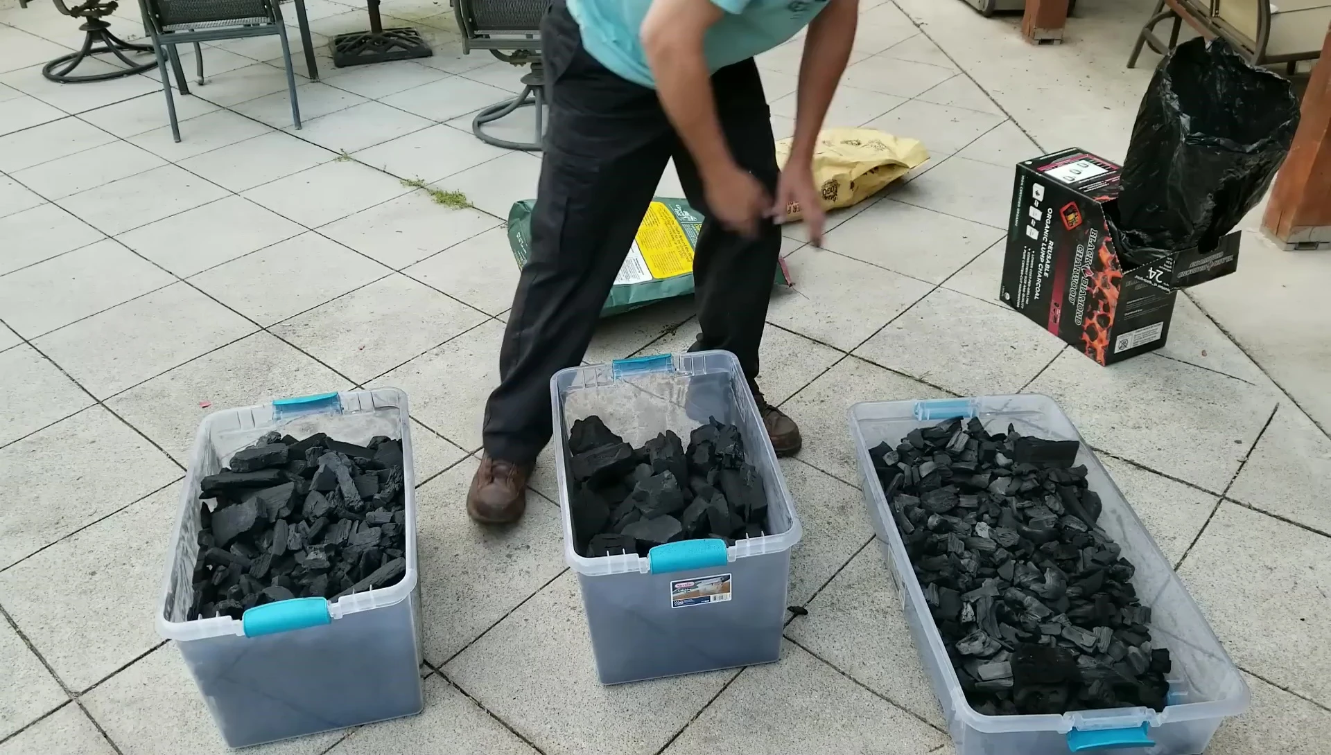 Three bins of charcoal for grilling.