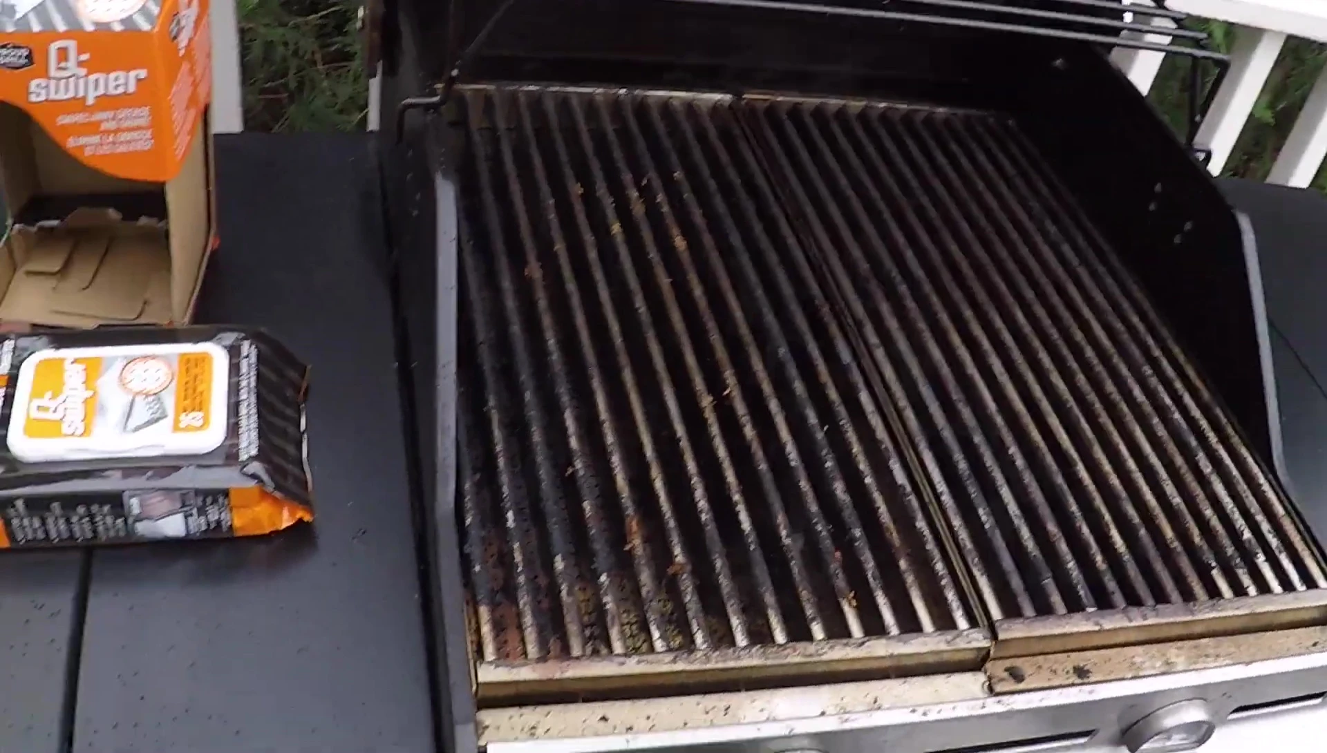 Using the scraper to remove large burnt residue.