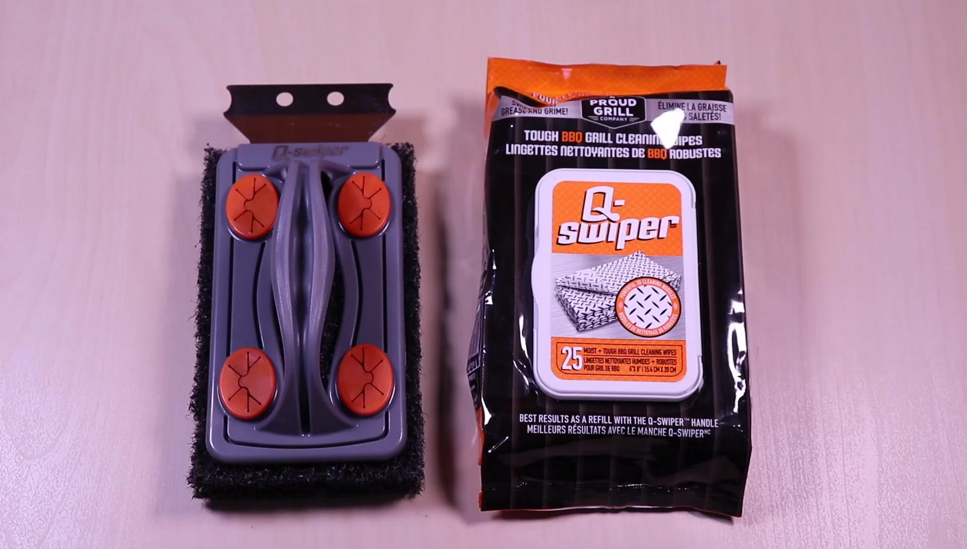 Close-up of the Q-Swiper kit contents: wipes and cleaning brush.