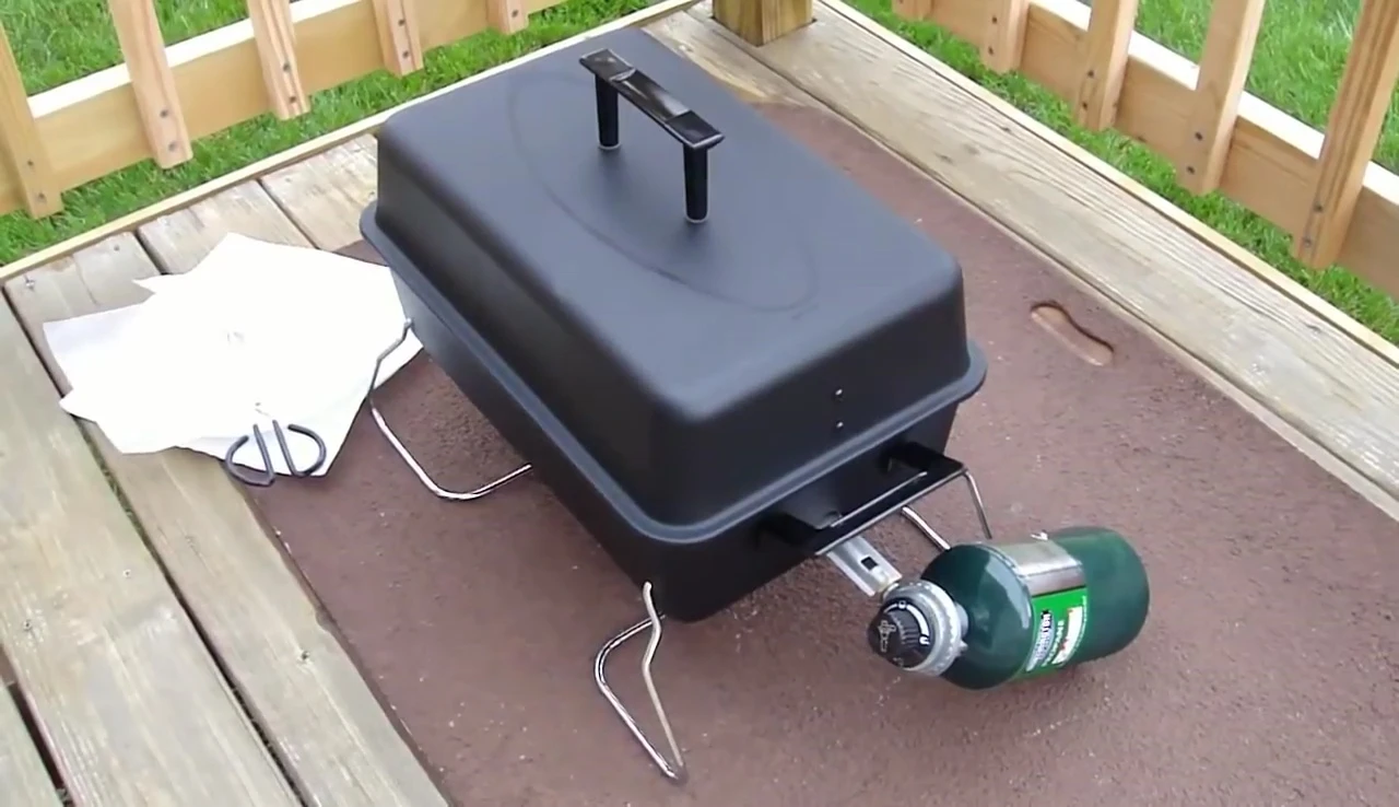 Hot dogs cooking on the grill.