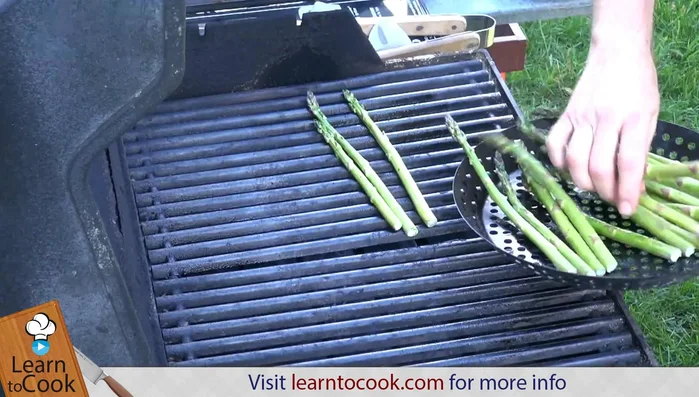 Wash asparagus. If thin, lay them across the grill bars, not between them, to prevent sticking.