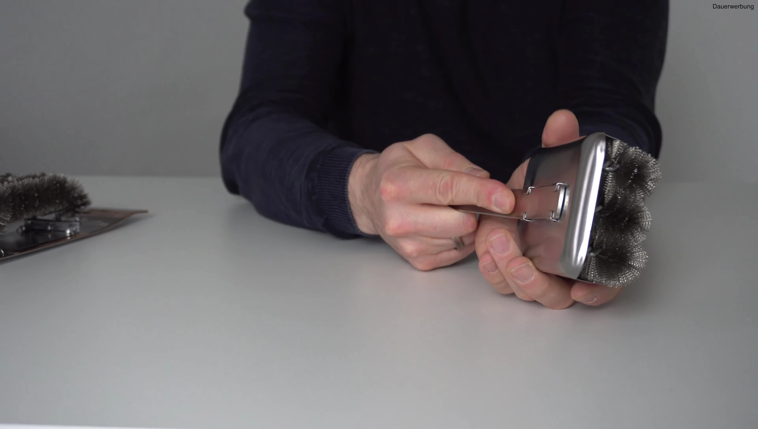Demonstrating the removal of the brush head