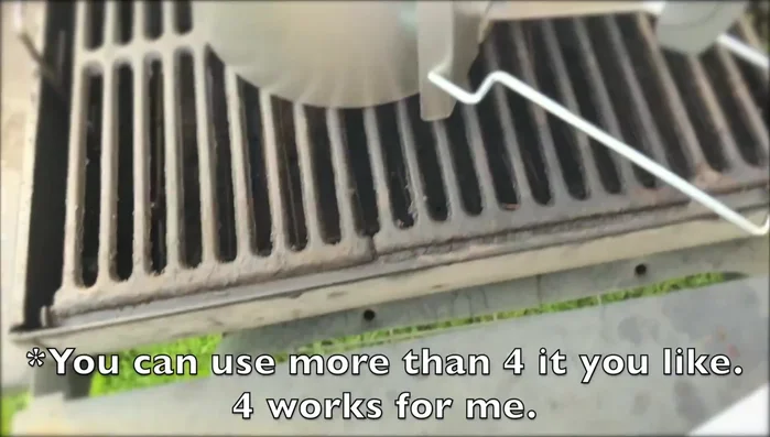 Ball up paper (not too tight) and place them under the chimney starter on the grates.