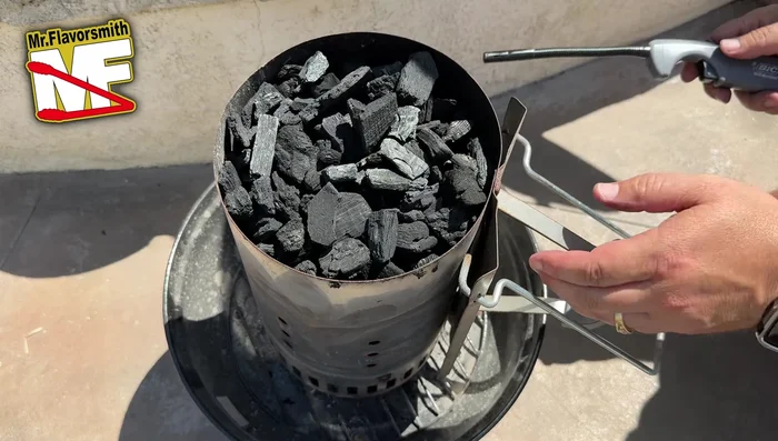 Replace the chimney over the lit fire starters. Wait for the charcoal to heat up and ignite the tumbleweed (approximately 7-12 minutes).