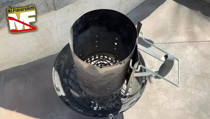 Prepare your chimney starter. Place it on a heat-resistant surface (a cheap grill is ideal, but you can use your main grill).