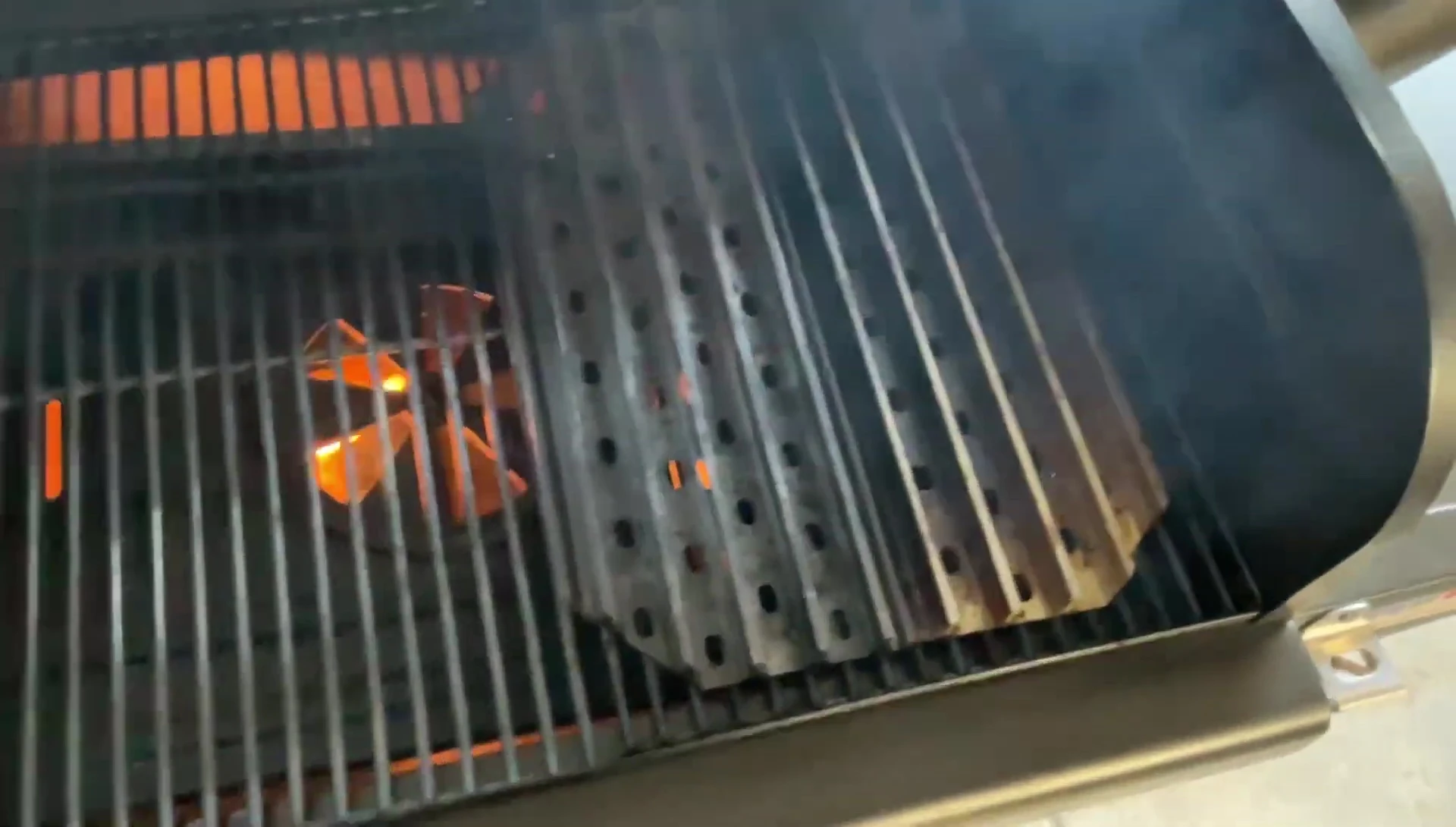 Grill grates being placed on the Z Grills 600 series.