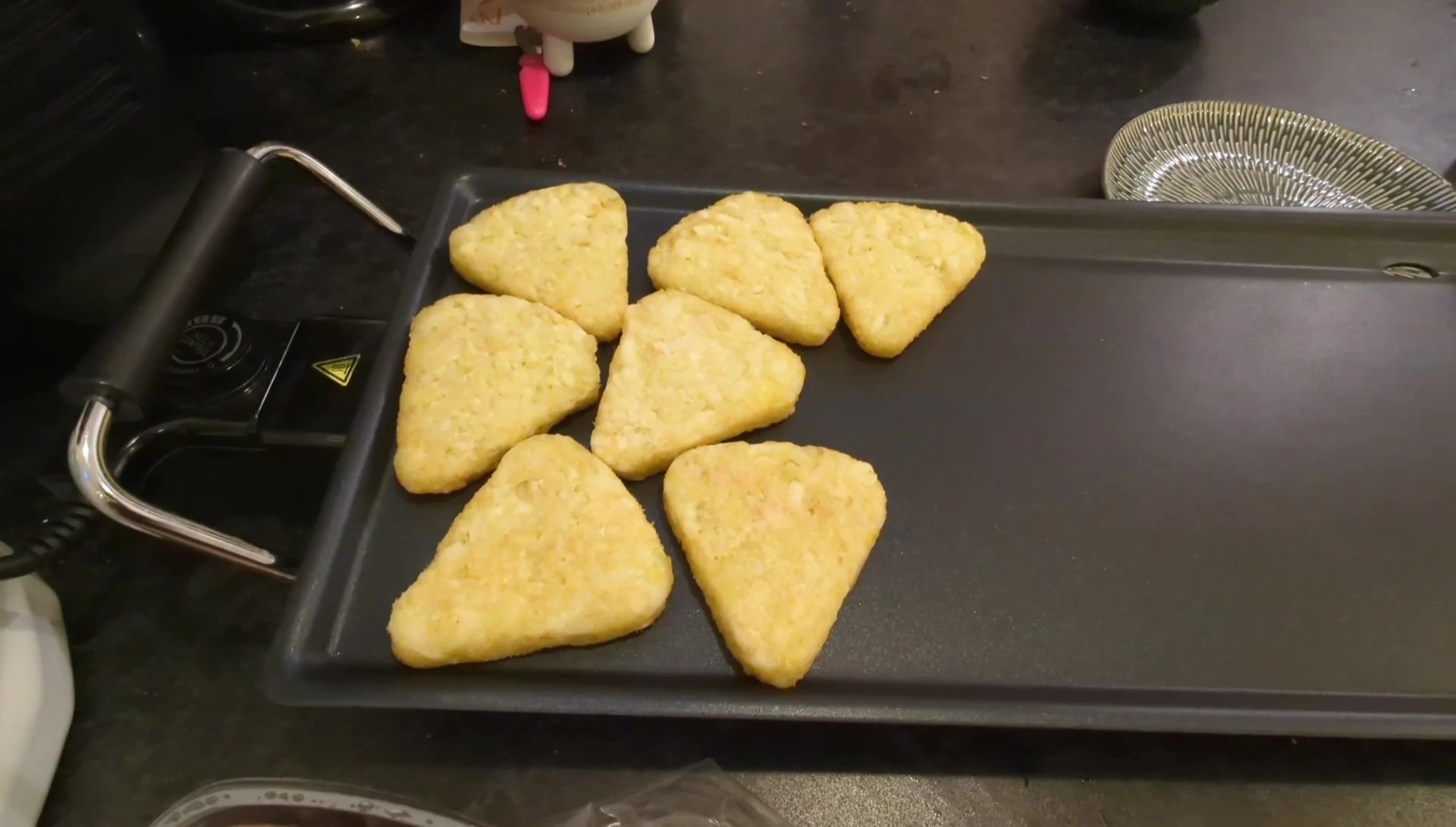 Hash browns cooking on the grill