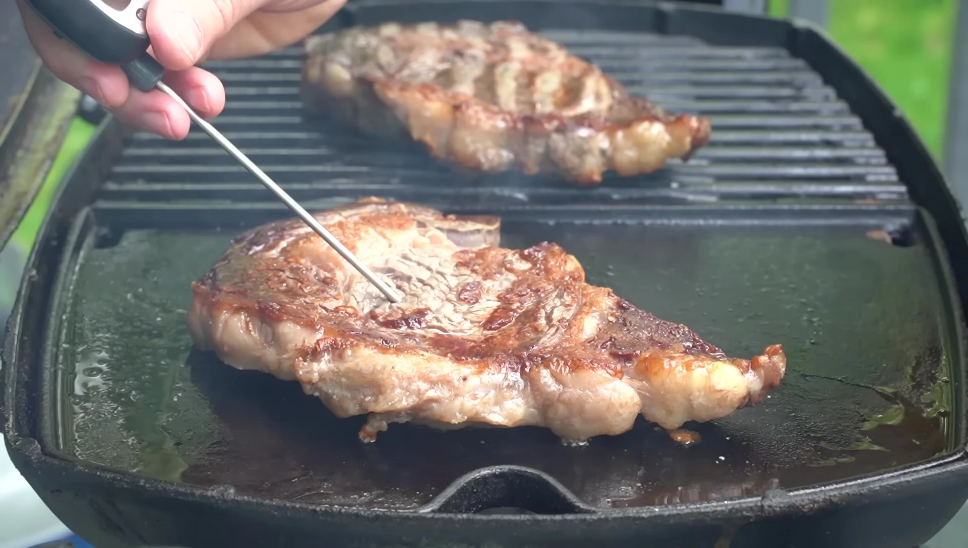 Checking the steak temperature with a thermometer