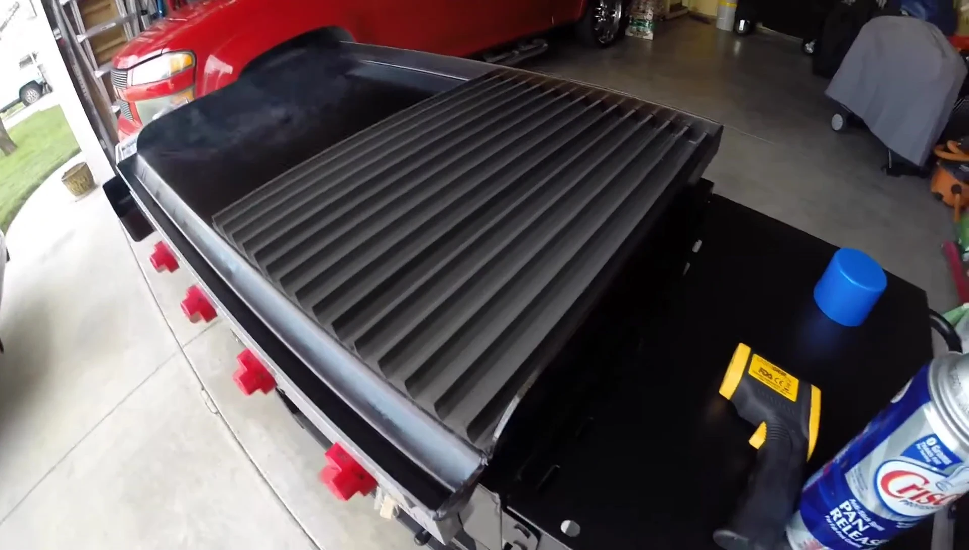 The Grill Grates sitting on the Camp Chef flat top grill