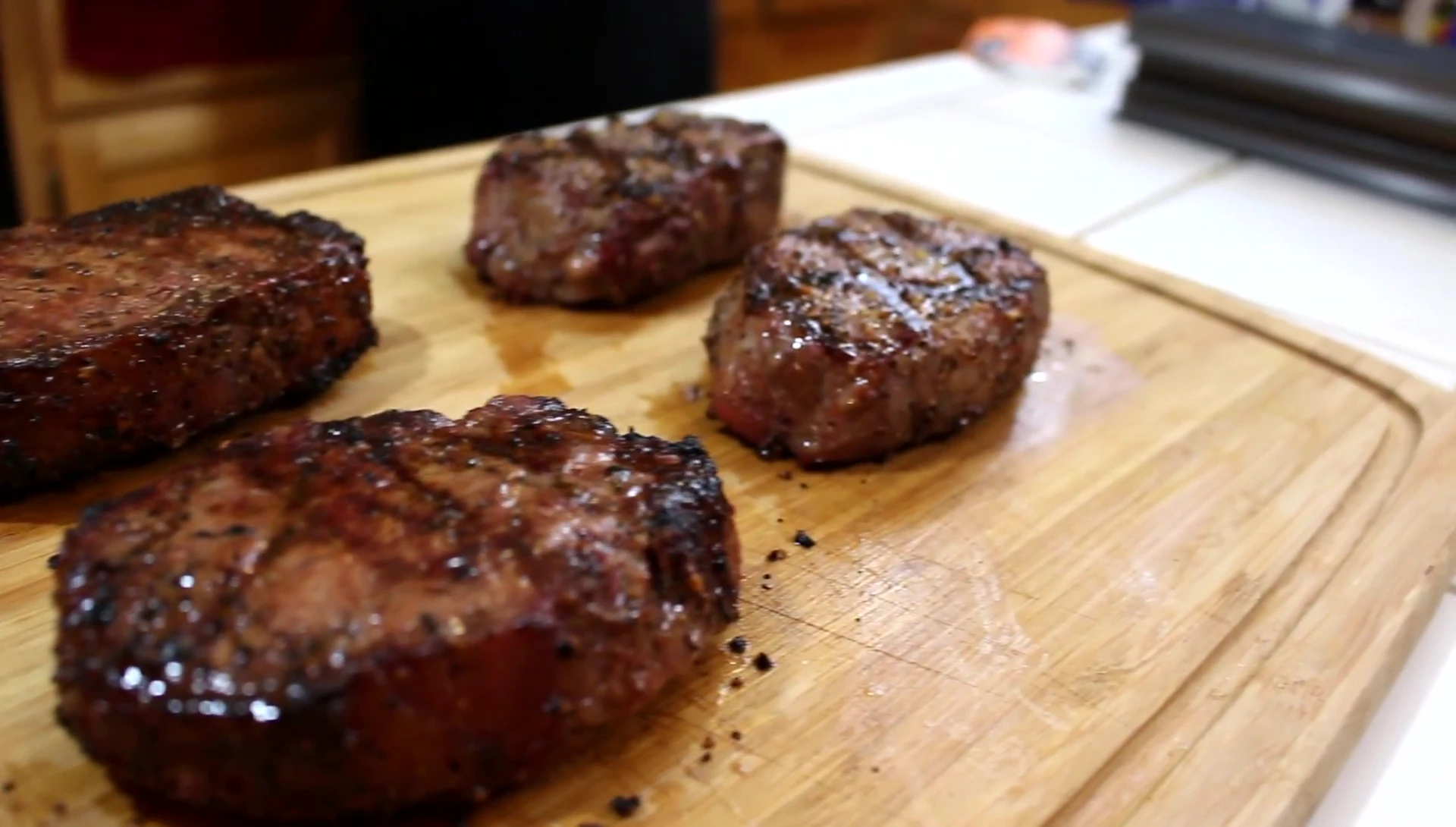 Comparison of steaks cooked on GrillGrate vs. standard grates.