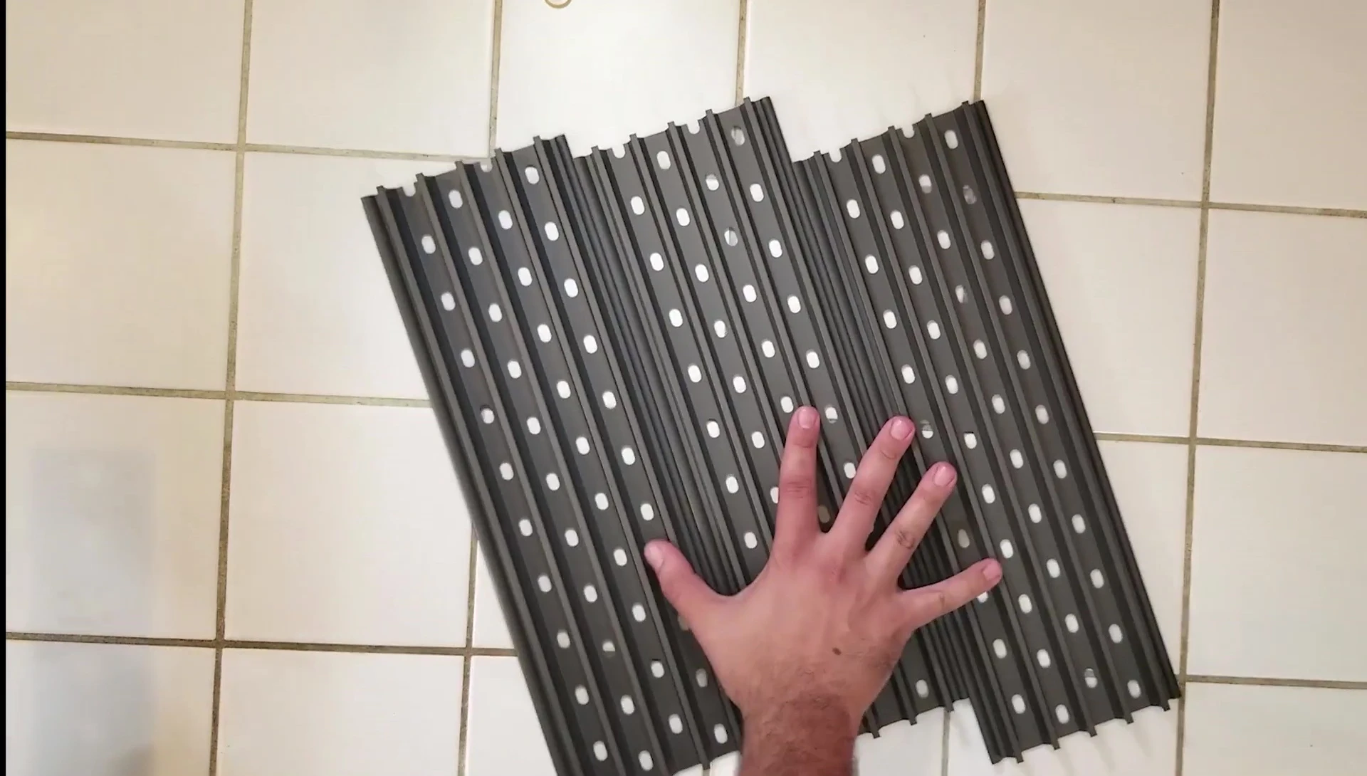 GrillGrate sections shown being configured on a grill.