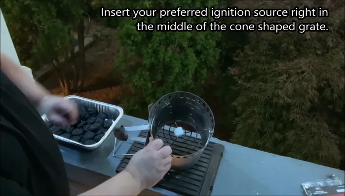 Place the ignition source in the middle of the conical grate.