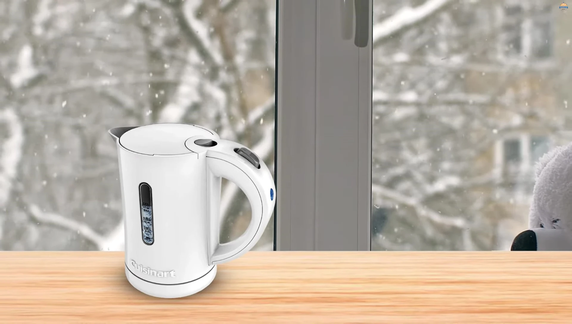 Demonstrating the Cuisinart's lid and button