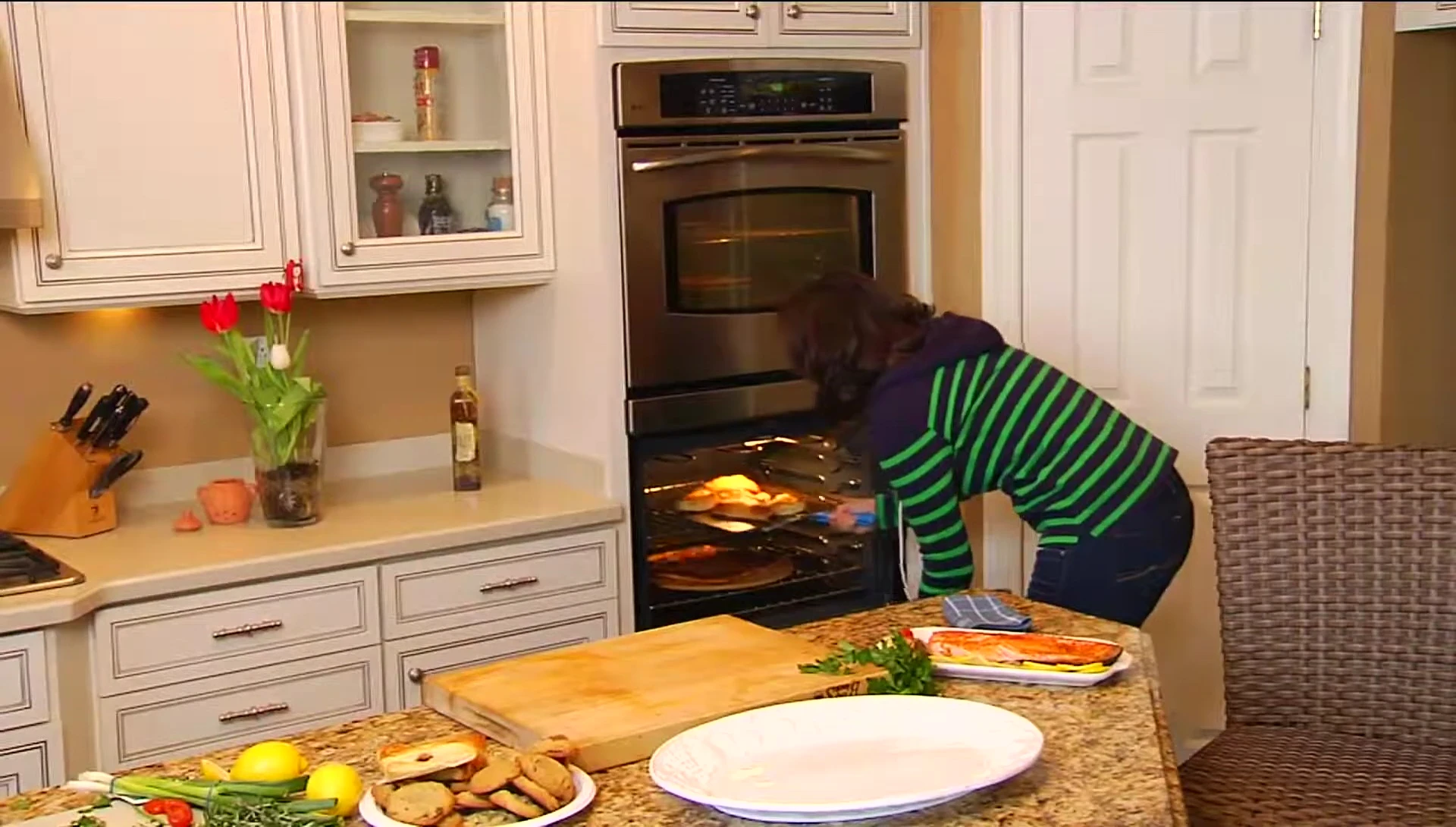 The spatula used as a pizza peel to remove a pizza from an oven.