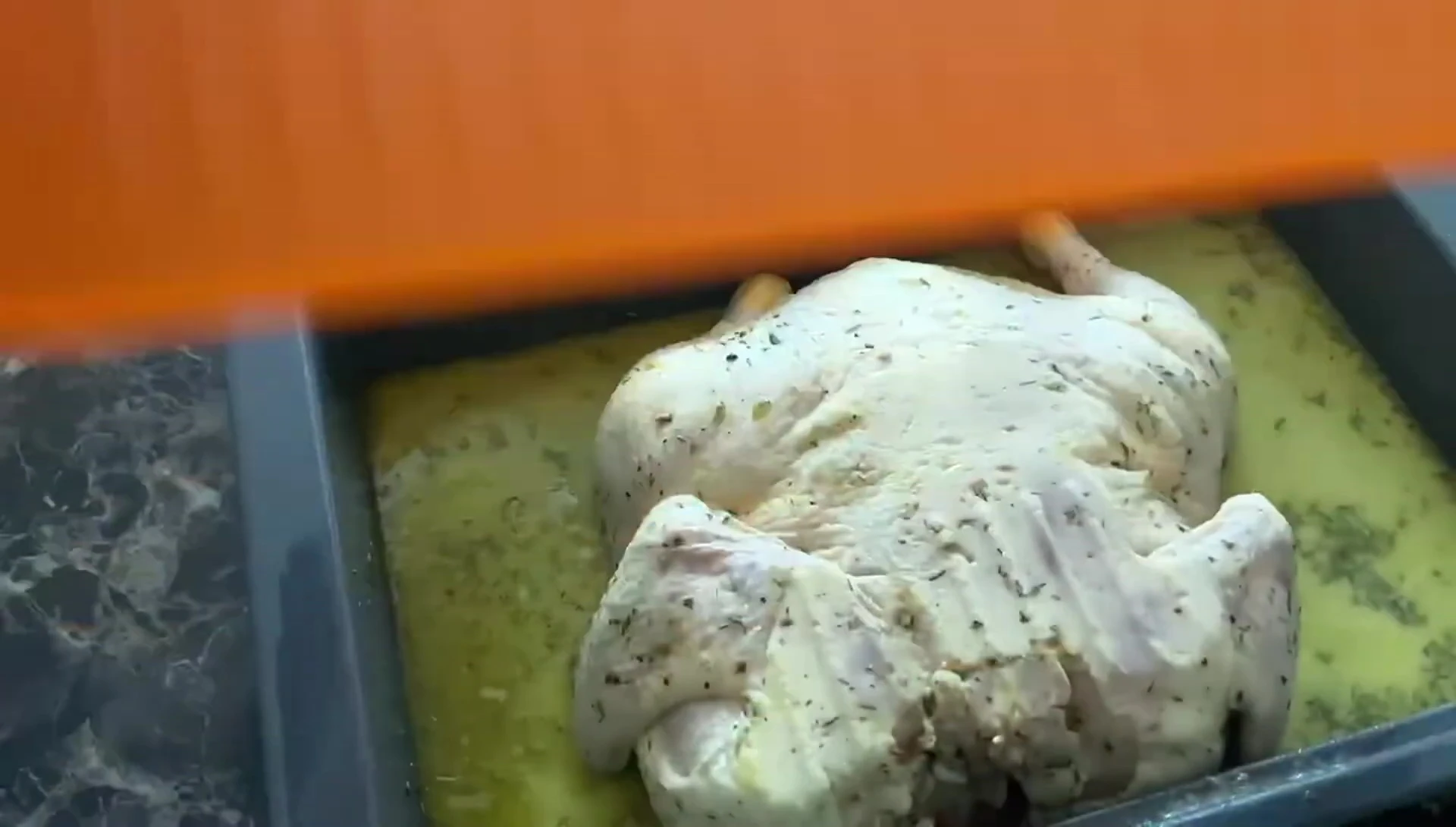The reviewer setting the marinated chicken to come to room temperature.